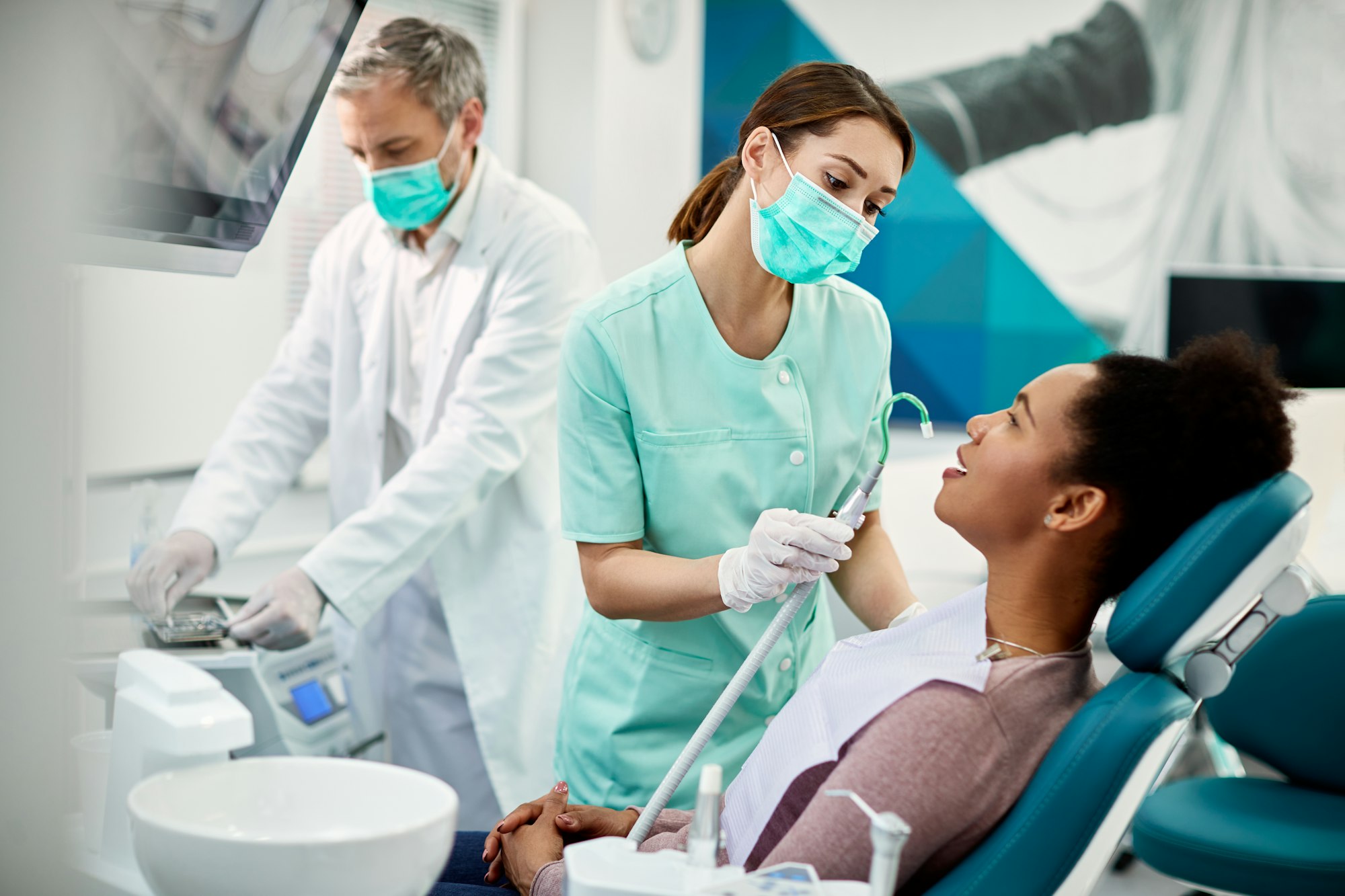 African American woman having dental treatment at dentist's office.