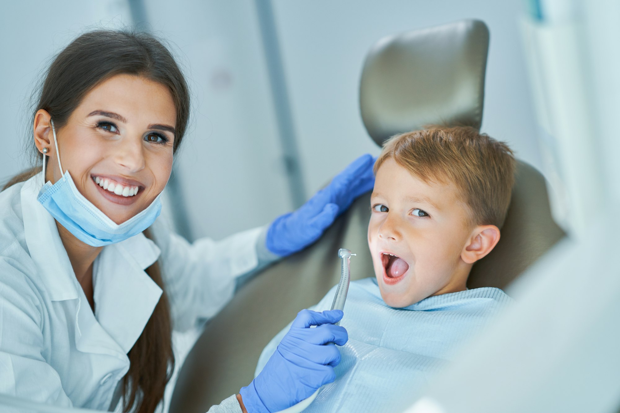 Little boy and female dentist in the dentists office